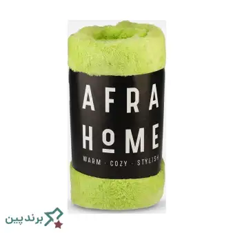 پتوی تکرنگ افرا (Afra) با بافت مایکروفایبر، روی مبل مدرن، در طیف رنگی خنثی و شاد