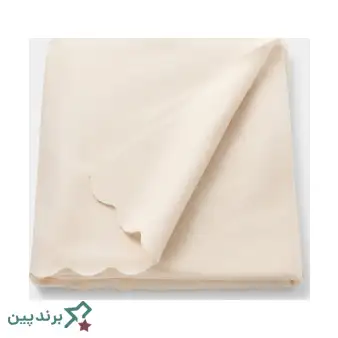 پتوی سبک ایکیا (IKEA) با بافت ژاکارد، به شکل شال مبل روی کاناپه